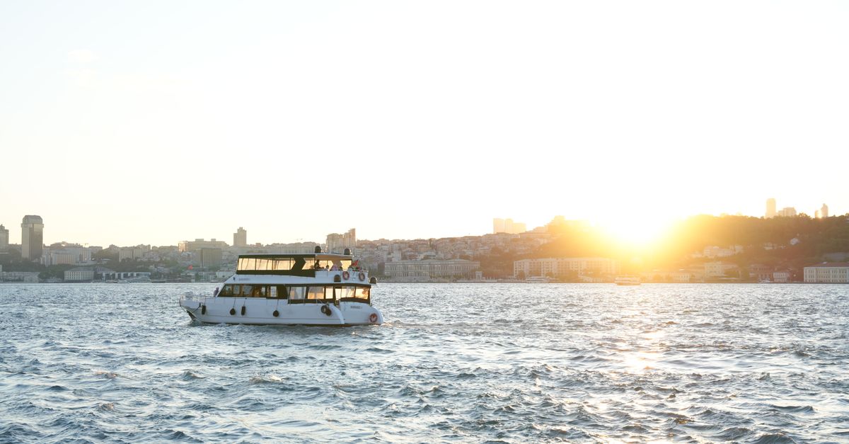 Luxury yacht cruising Biscayne Bay at sunset